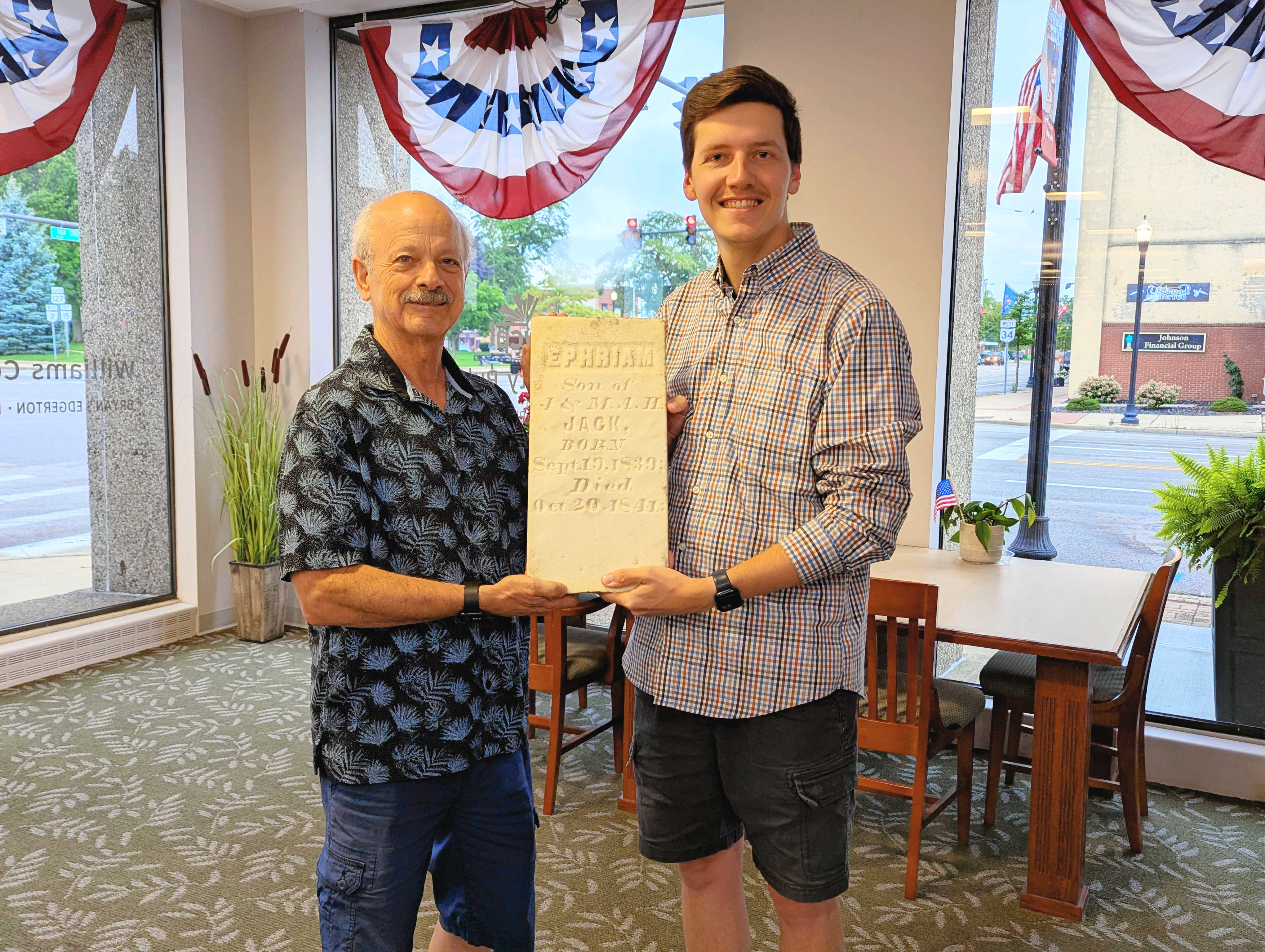 Jared Schnee and Jim Brokaw holding Ephriam Jack Tombstone 